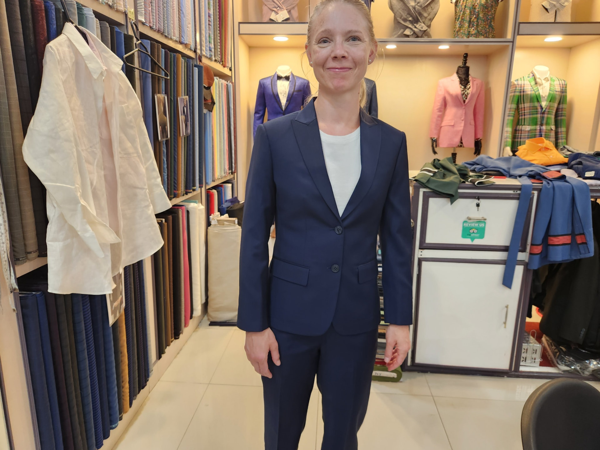 Customer wearing a women's navy bespoke trouser suit tailored in Karon Beach, Phuket