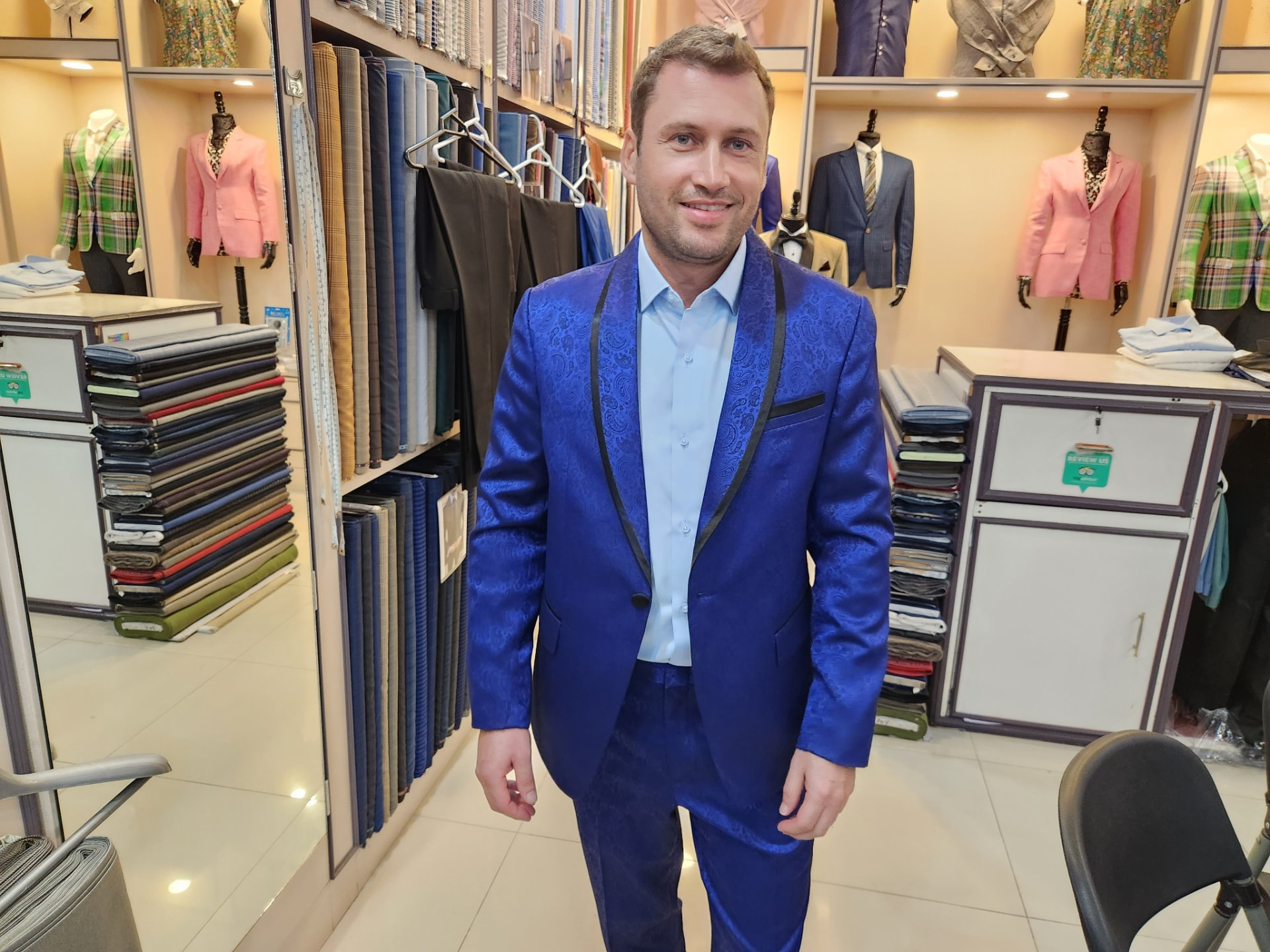 Customer wearing a royal blue paisley tuxedo made by Sam Boutique Tailors Phuket